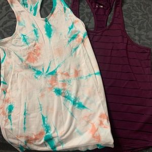 2 Zyia tanks. Purple is sheer and loose fitting and tie dye is fitted. Medium